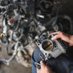 Auto,Mechanic,Disassembly,An,Electronic,Throttle,Body,From,The,Engine.
