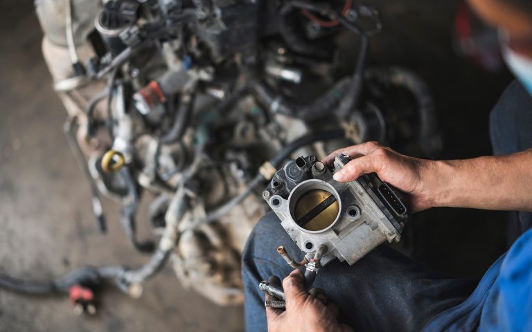 Auto,Mechanic,Disassembly,An,Electronic,Throttle,Body,From,The,Engine.